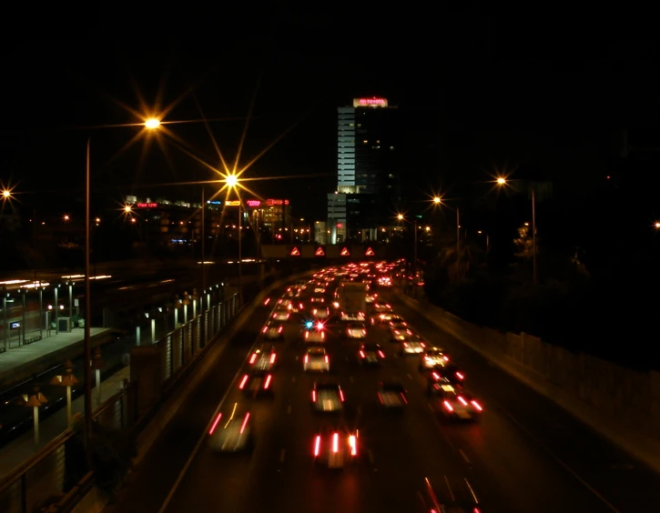 a freeway is pictured in the dark with traffic on it