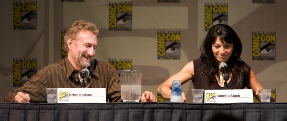 a man and woman are sitting at a table