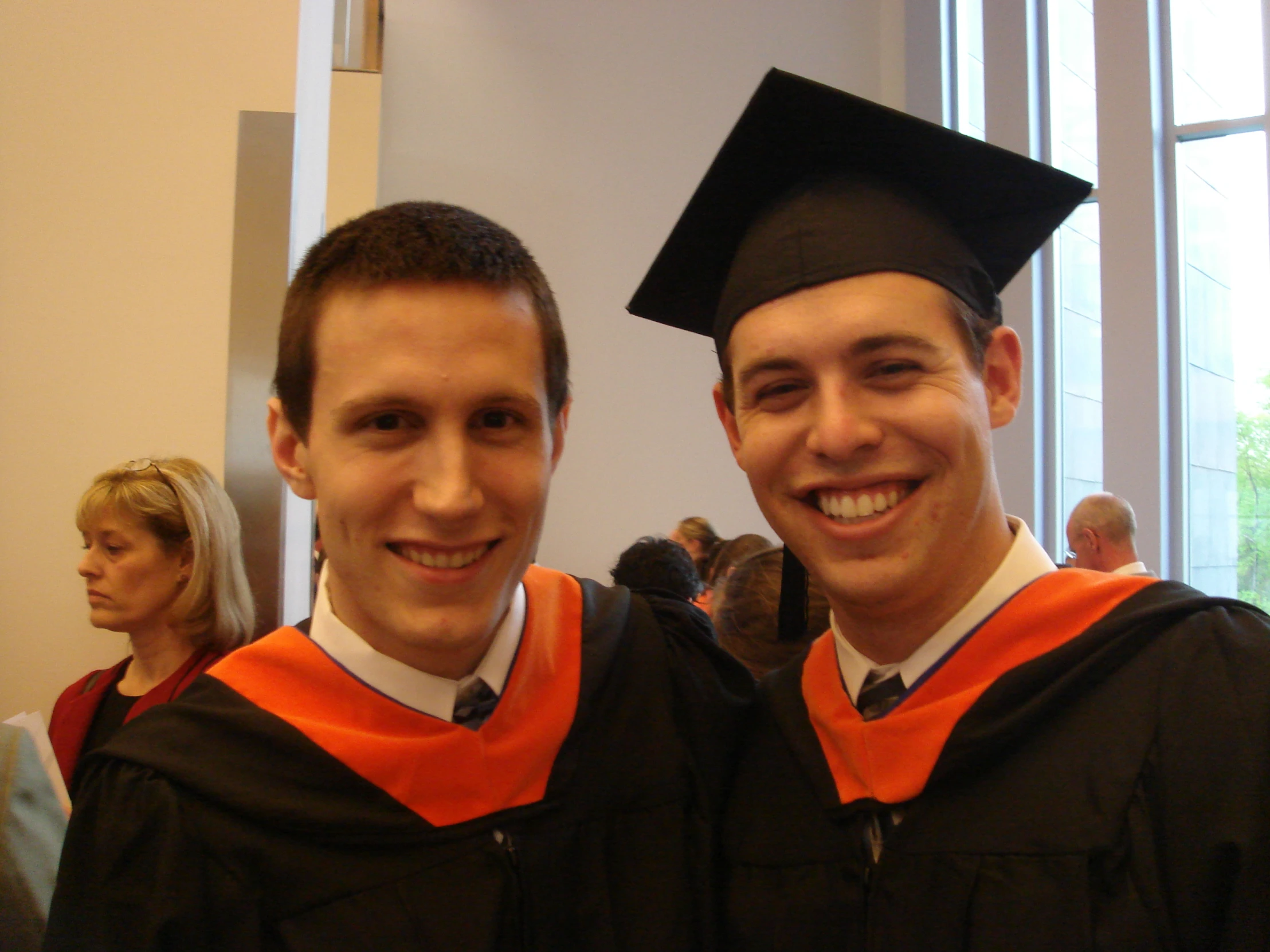 two people in graduation regals at the university