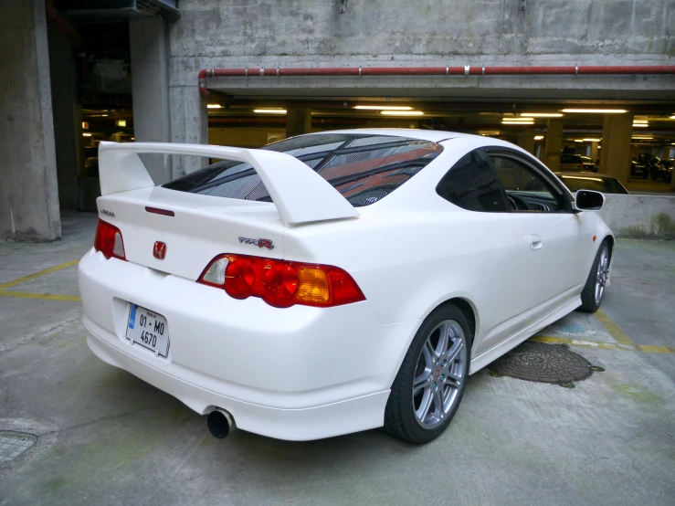 the rear end of a white sports car
