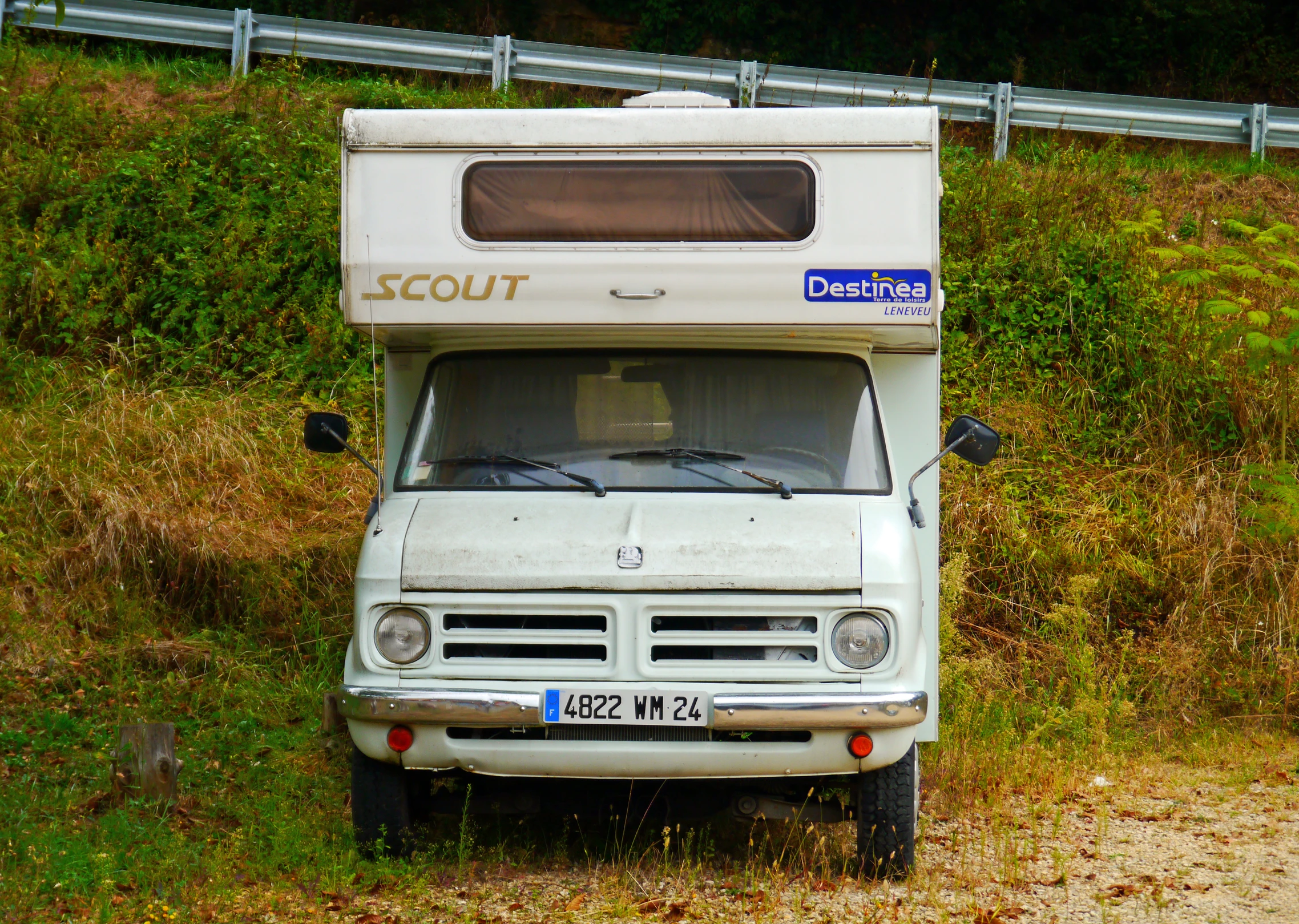 an old truck with a trailer attached to it's back