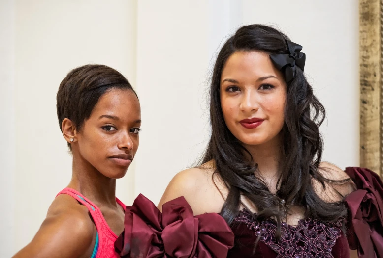 two women with big bows and their tops flowing