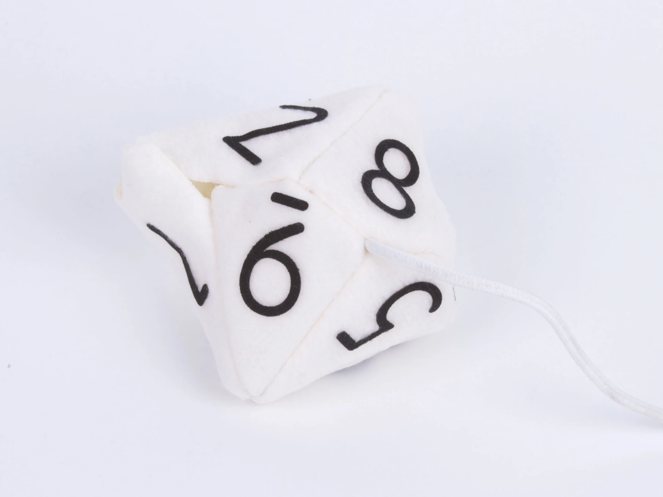 a white dice that is shaped like the number forty six