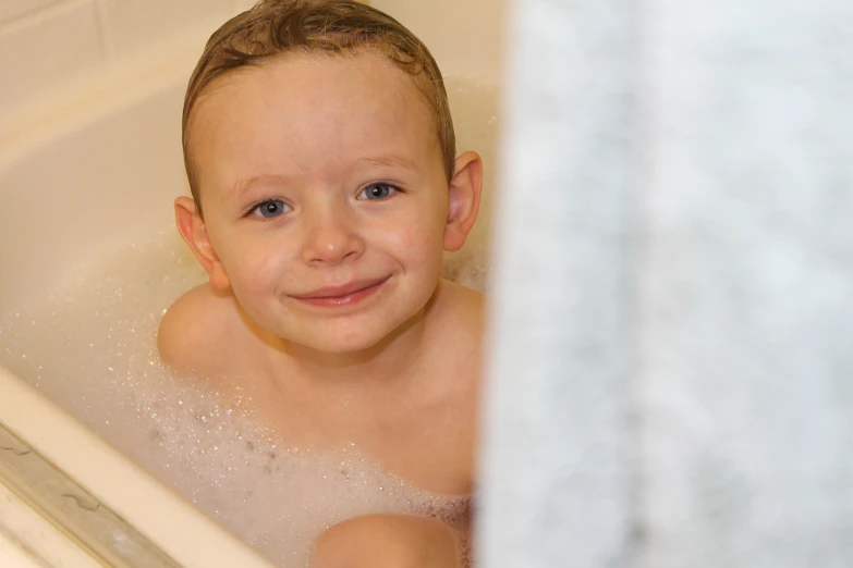 a  taking a bubble bath in a bathtub