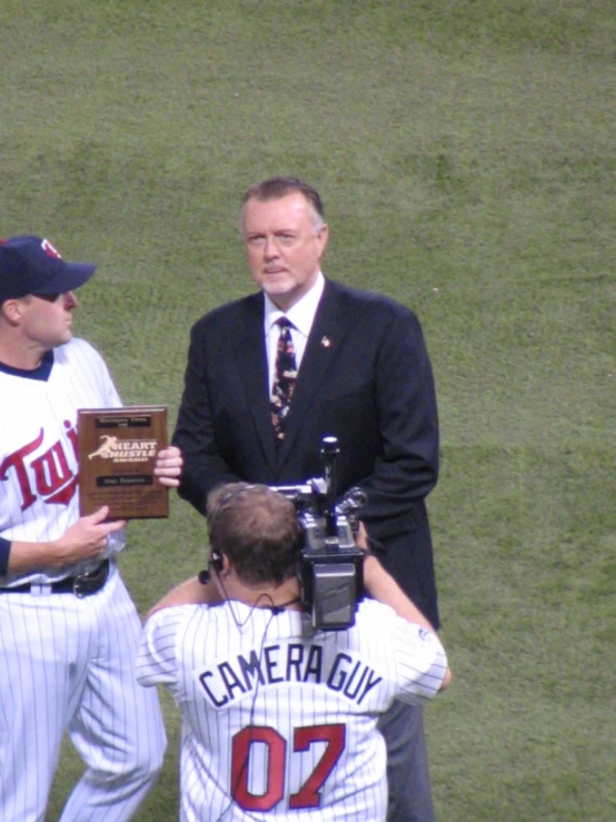 two baseball players are congratulating each other on the field