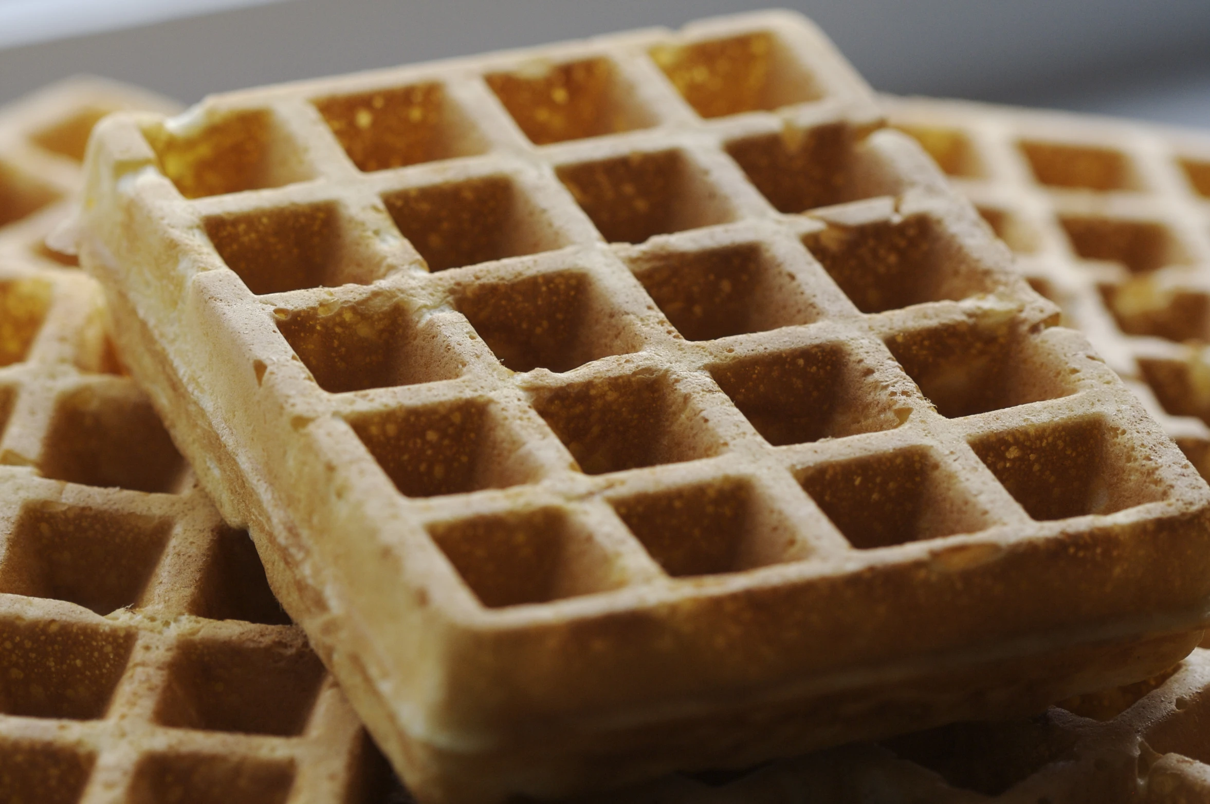 waffles stacked on top of each other on top of a table