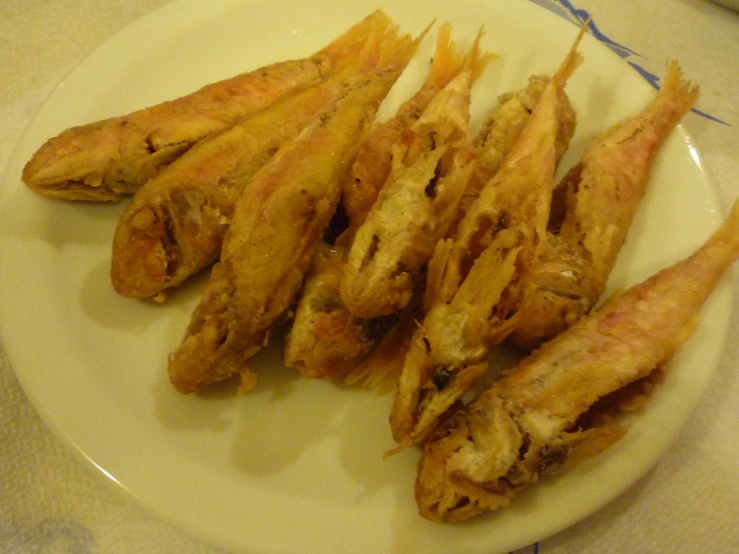 fried food items displayed on small plate on counter