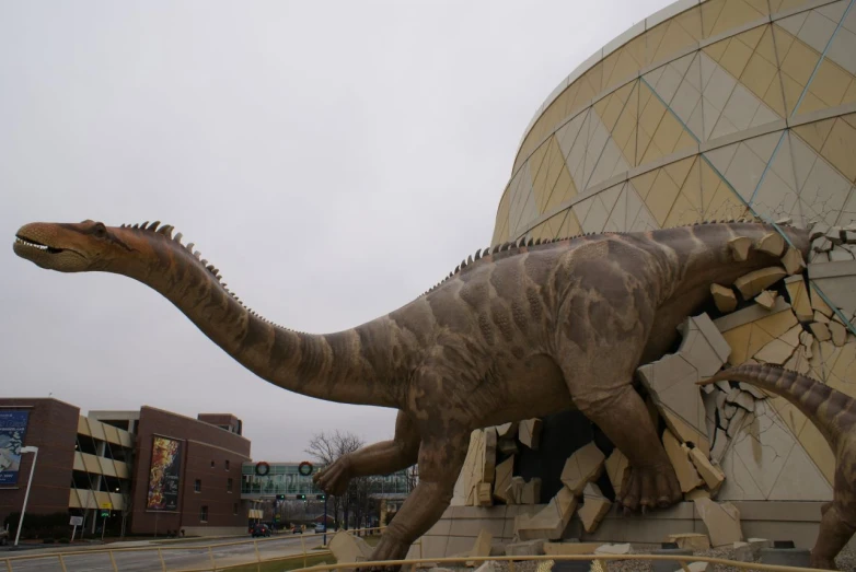 the dinosaur statue is beside the domed building