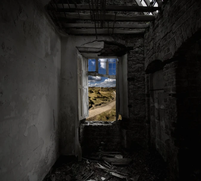 an image of an old abandoned building looking out the window