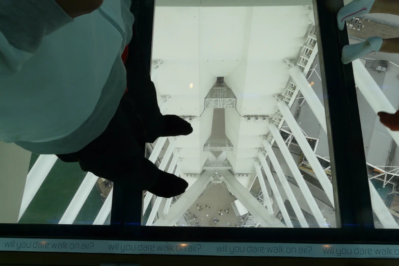 a view of the eiffel tower from inside the glass floor