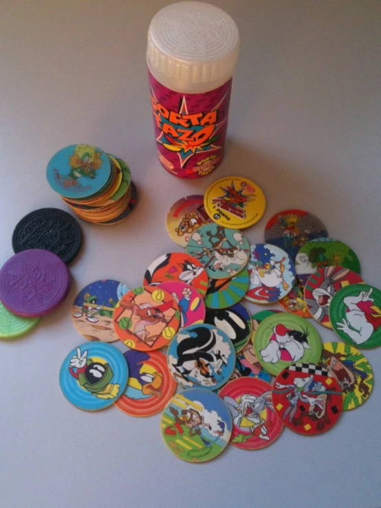 a group of children's on badges with a canister in the background