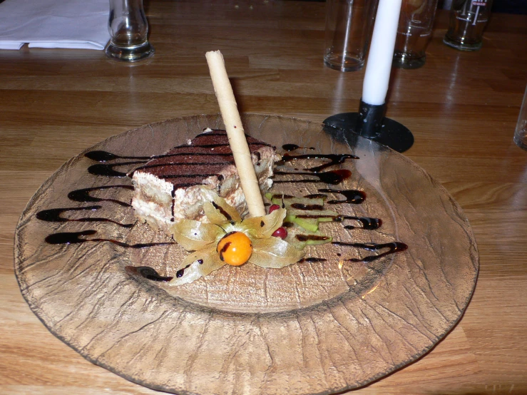 a plate with many different foods sitting on a wooden table