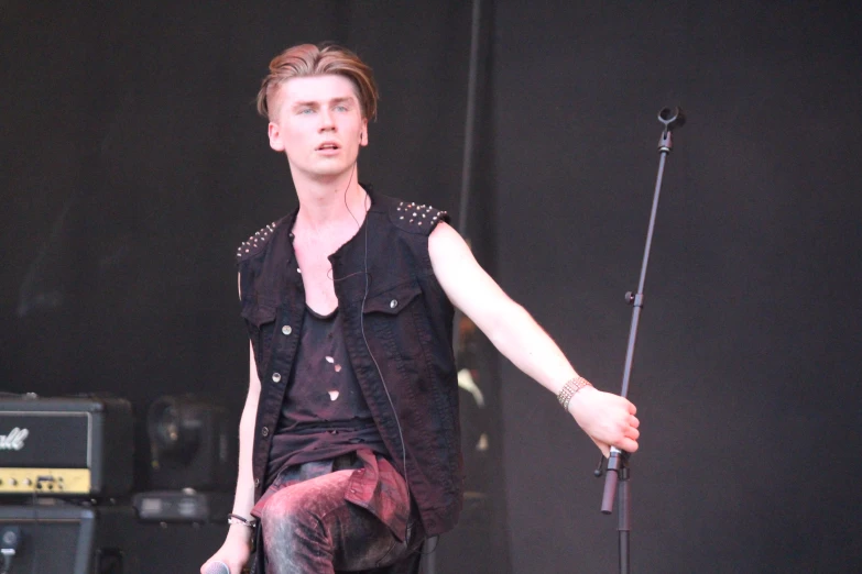 a person with an umbrella on stage at an event