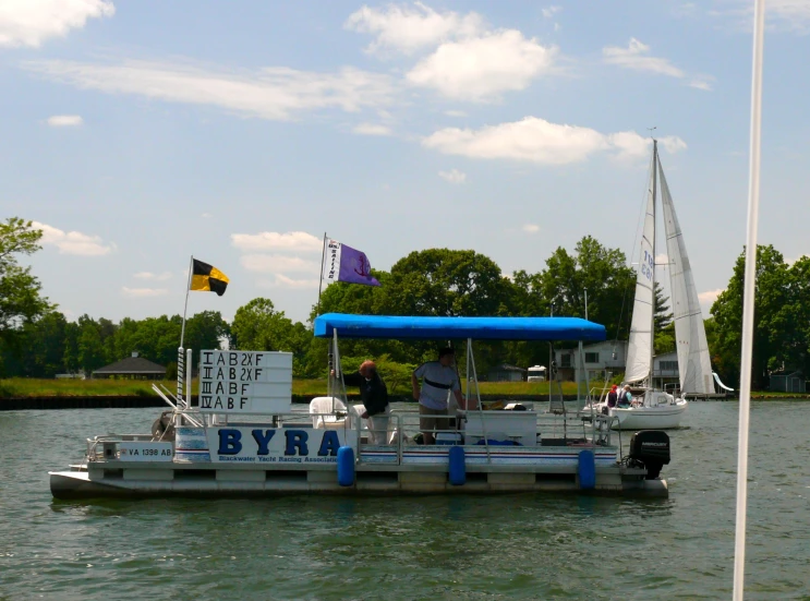 a boat filled with people on top of a body of water