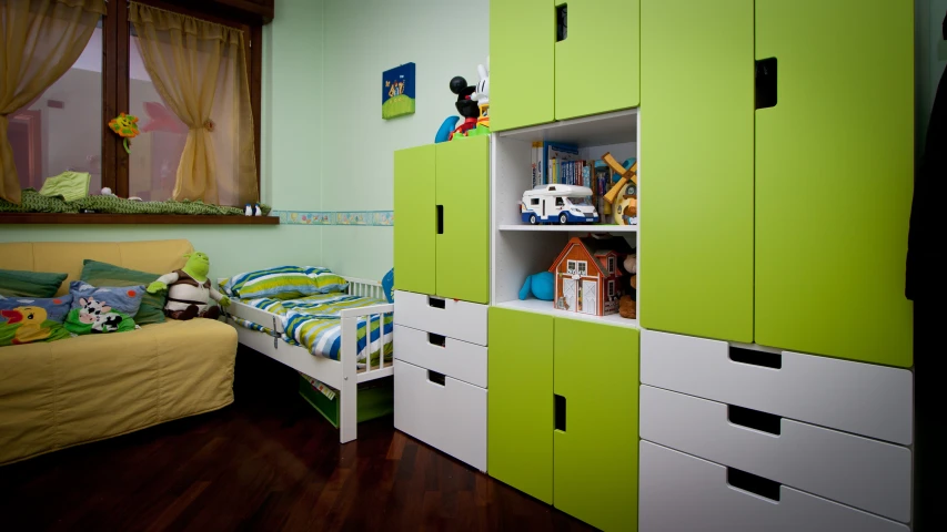 green and white colored bedroom with a small bed