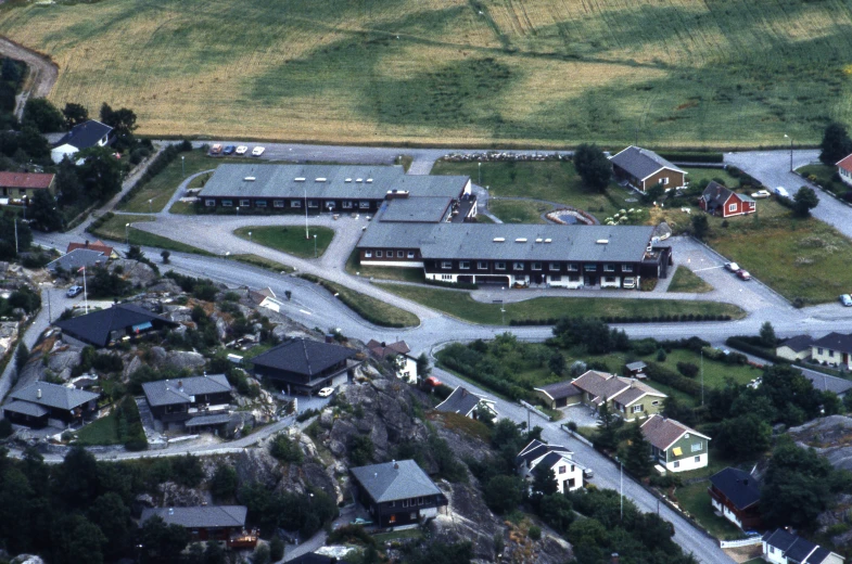 a town with houses and a road winding through it