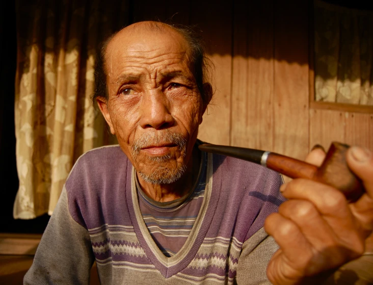 a man holding up an object in front of him