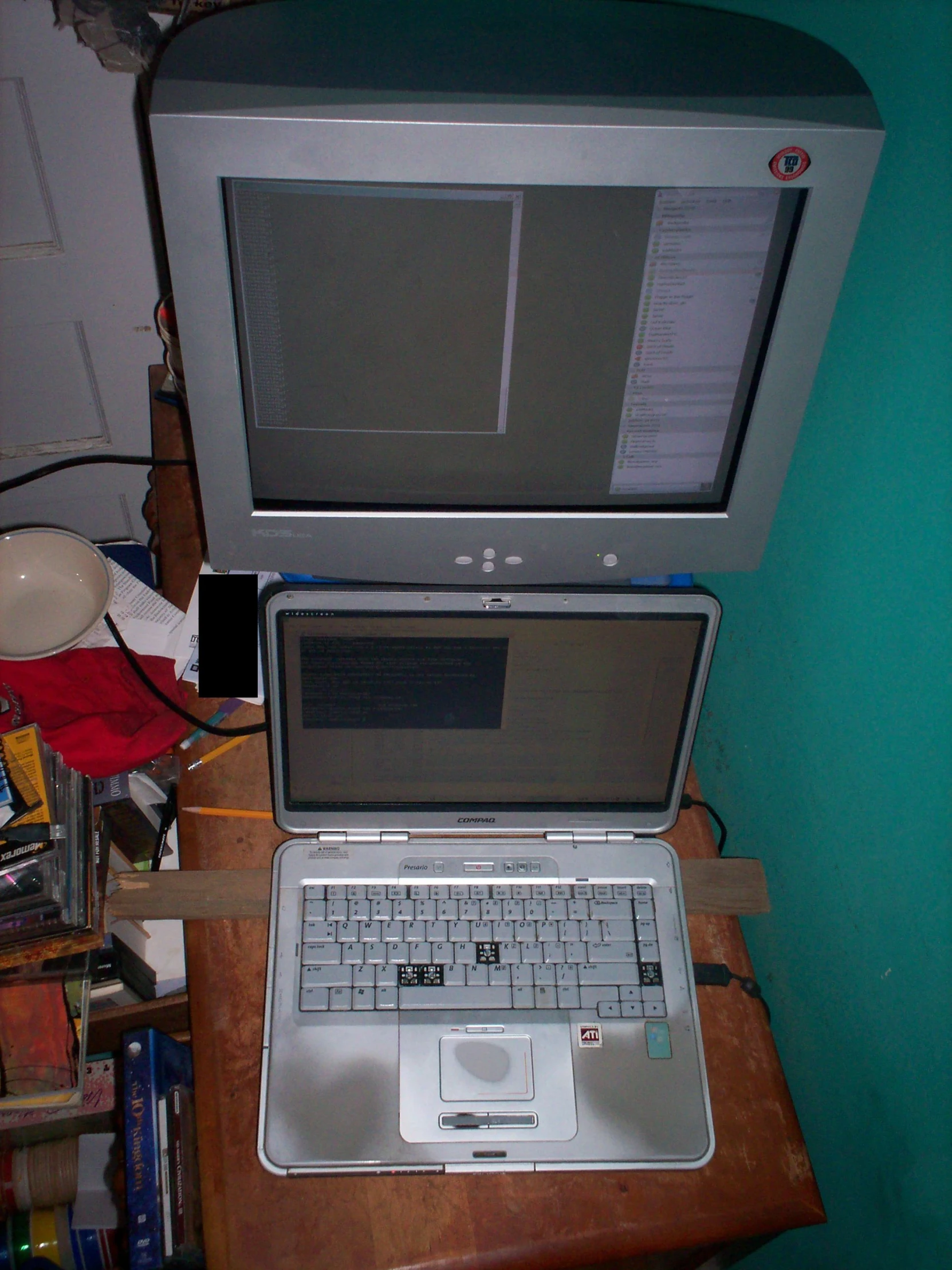 a laptop computer on top of a wooden desk