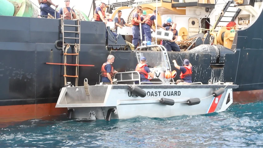 people boarding a boat at sea by the deck