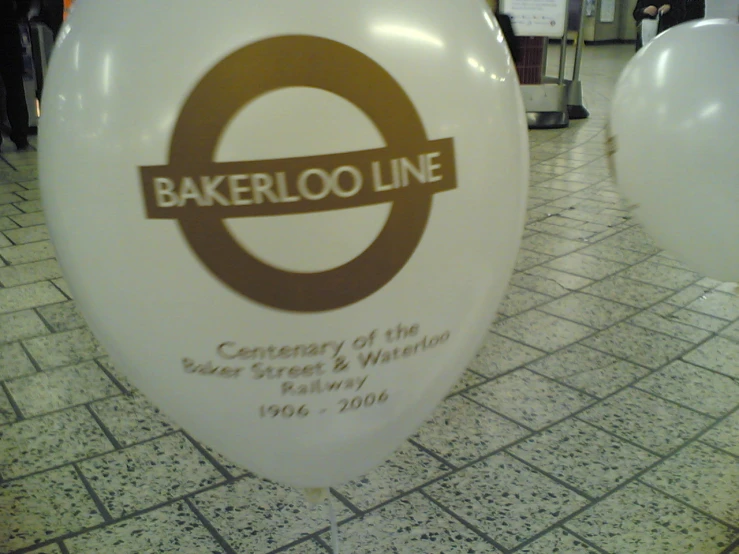 an inflated balloon depicting the logo of the bakery and the name of the shop