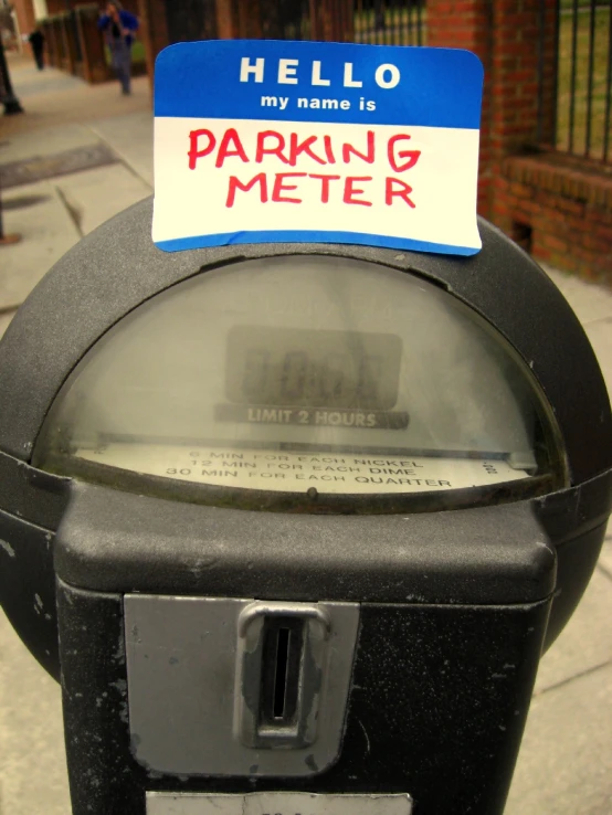 a parking meter is left with a sign on it