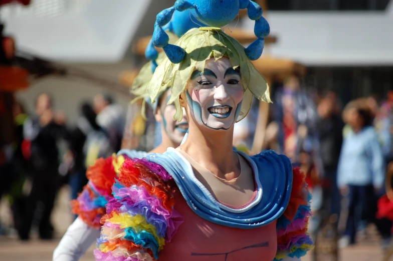 the woman in her colorful costume is staring away