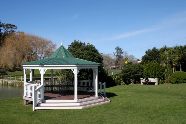 a gazebo that is on a grassy field