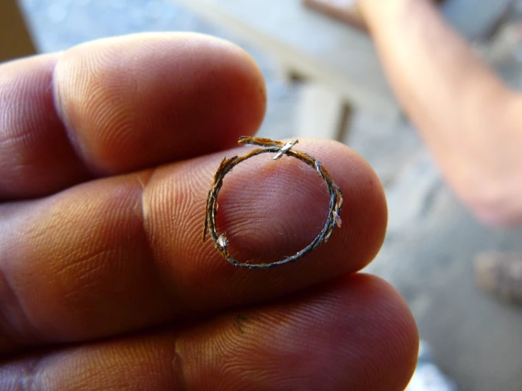 the small circle ring is held up to show how well it is made