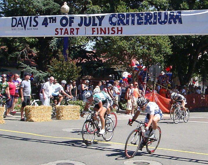 a crowd of people that are riding bikes