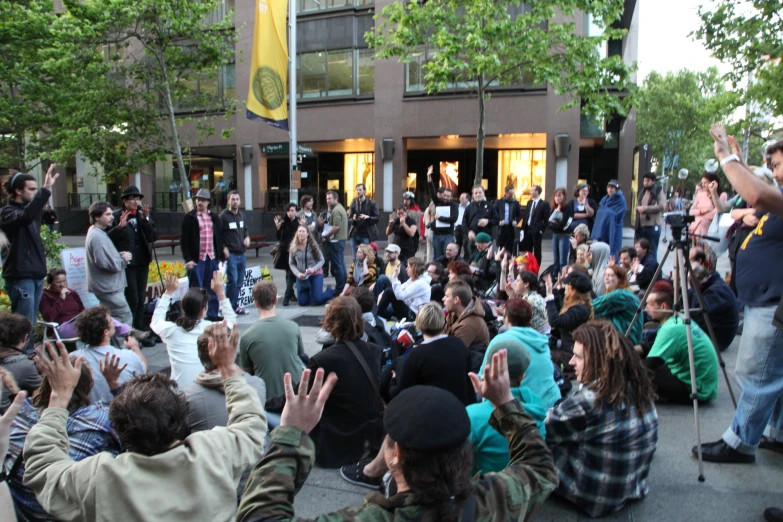 a large group of people gathered on the street