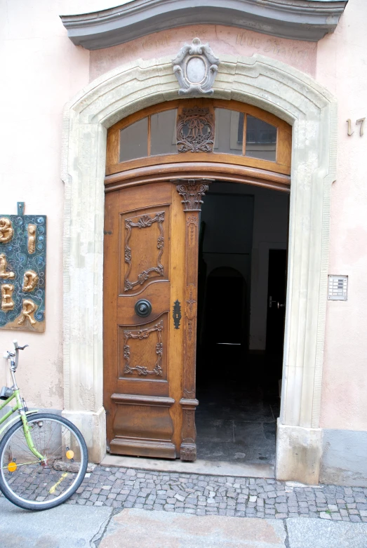 a bike parked in front of a wooden door