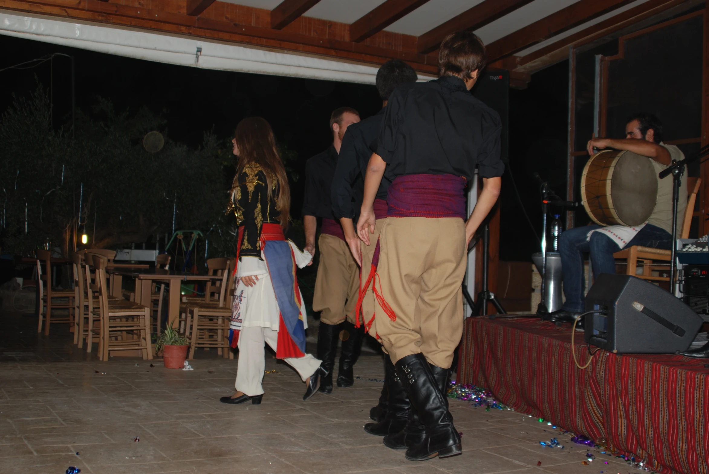 group of people standing on a floor near each other