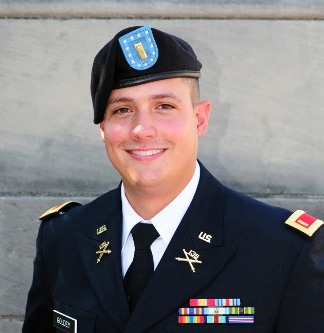 an air force man smiling for a pograph