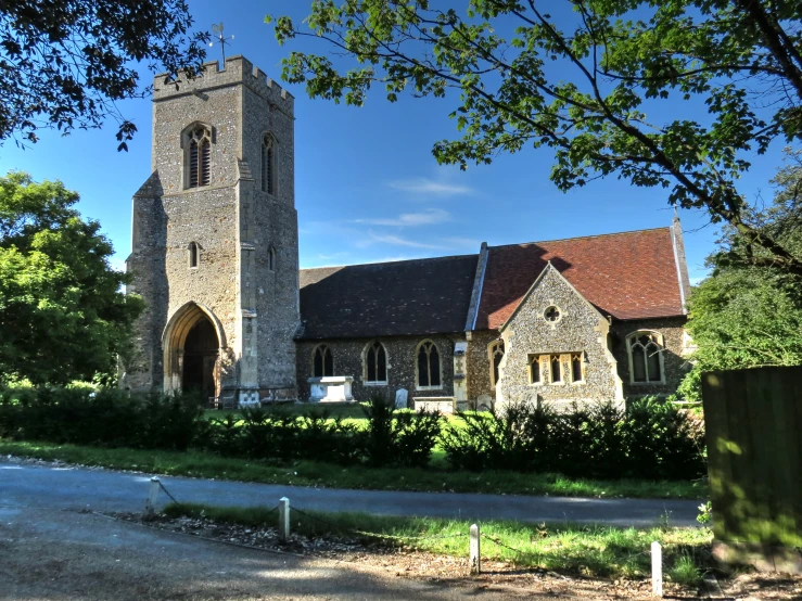 an old stone church in rural town with tall towers