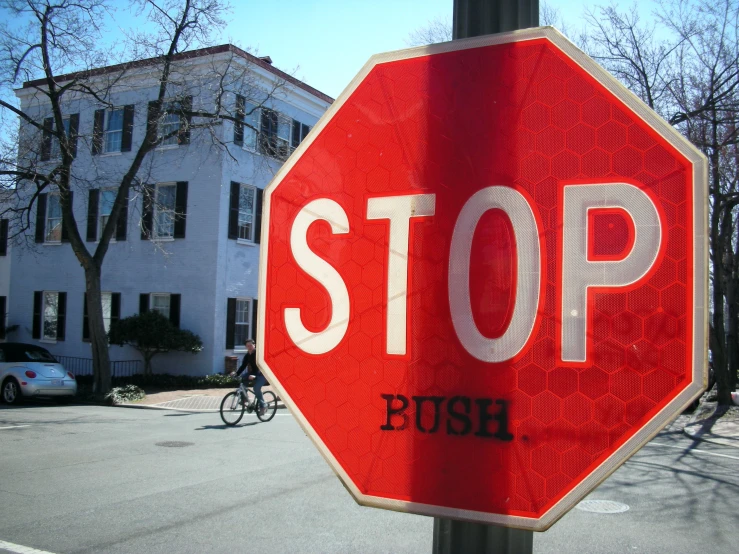 a stop sign that reads rush under the word stop
