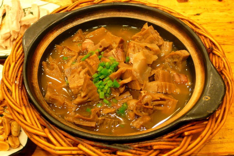 a bowl of food that has been cooked and served on a tray