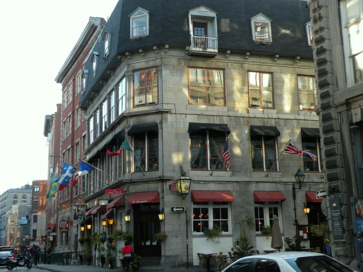 a street corner with cars parked in front of a building