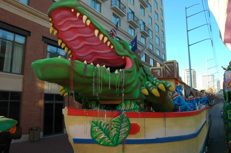 the parade floats are decorated with dragon heads