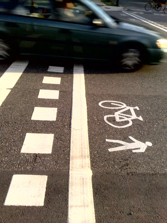 a car that is driving by a crosswalk