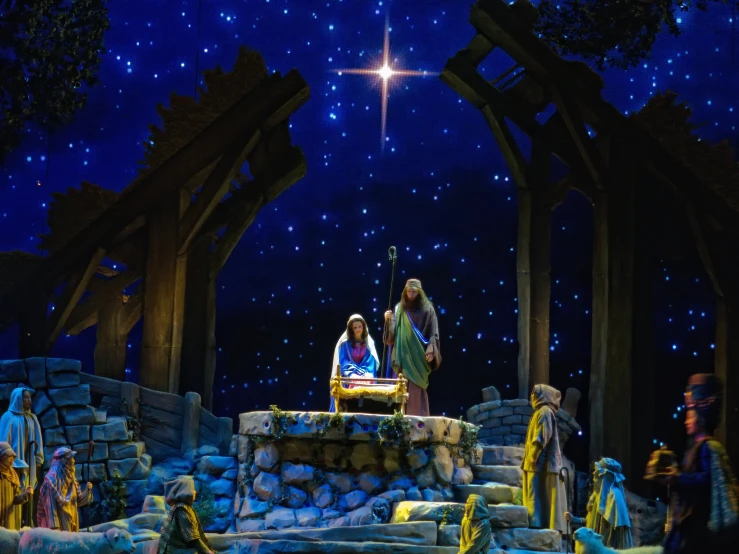 a christmas scene featuring two men and a woman