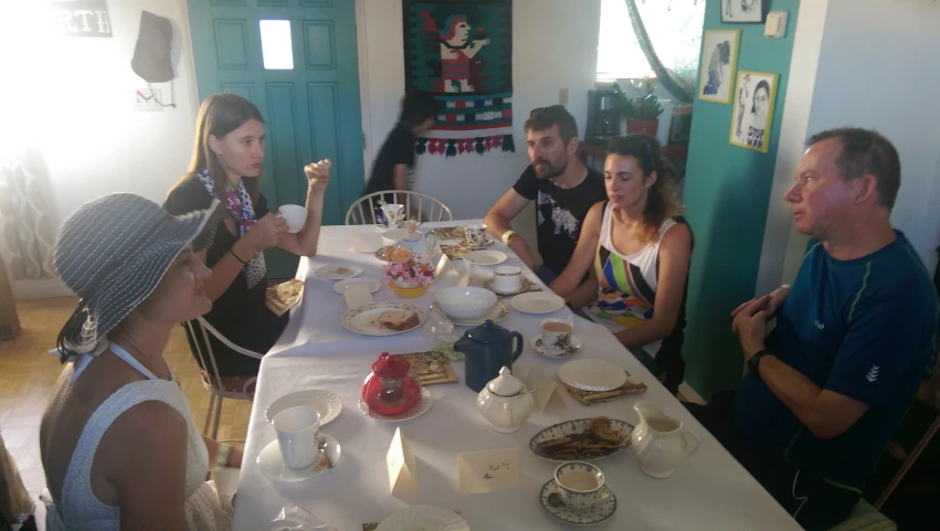 a group of people are seated at a table