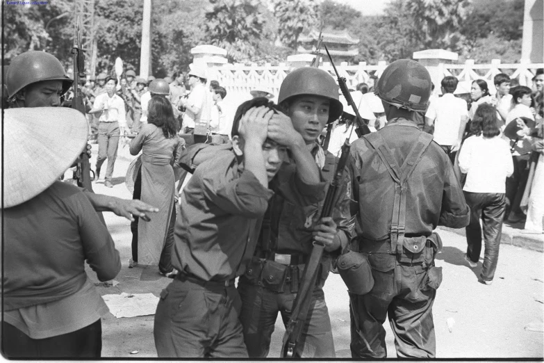 a group of people that are standing around