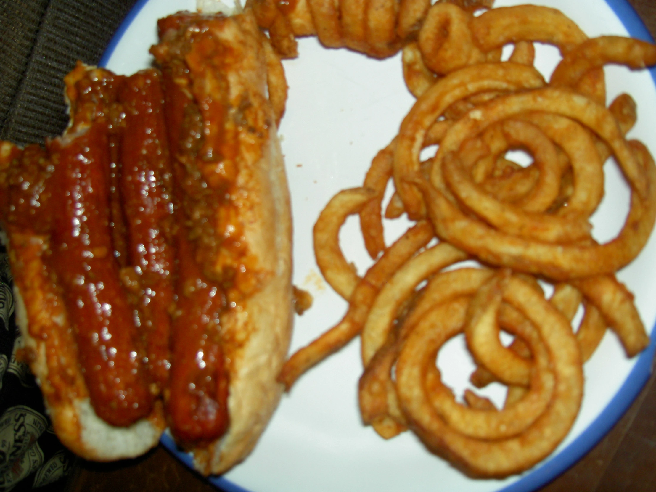 there is a plate with some fries and a dog