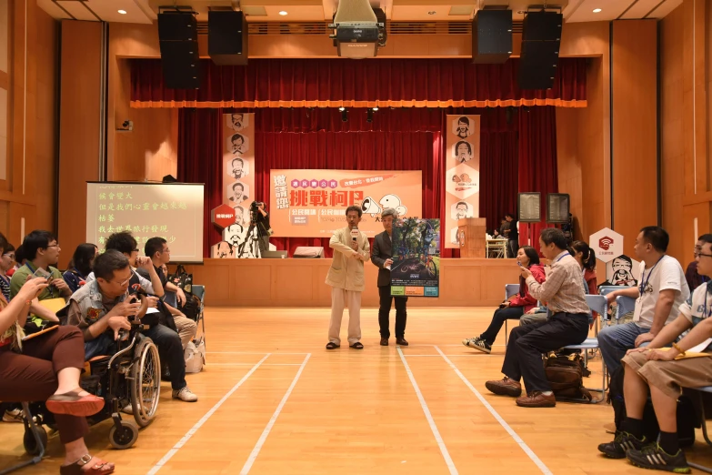 a man standing at the end of a runway speaking