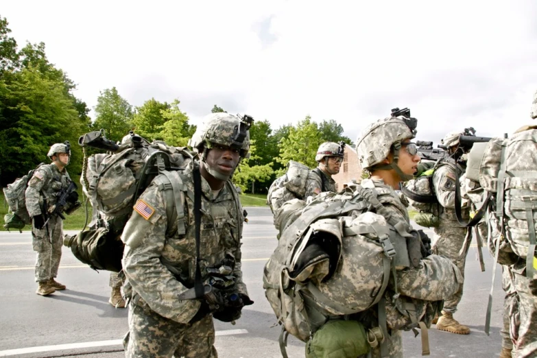 several army soldiers are gathered together in uniform