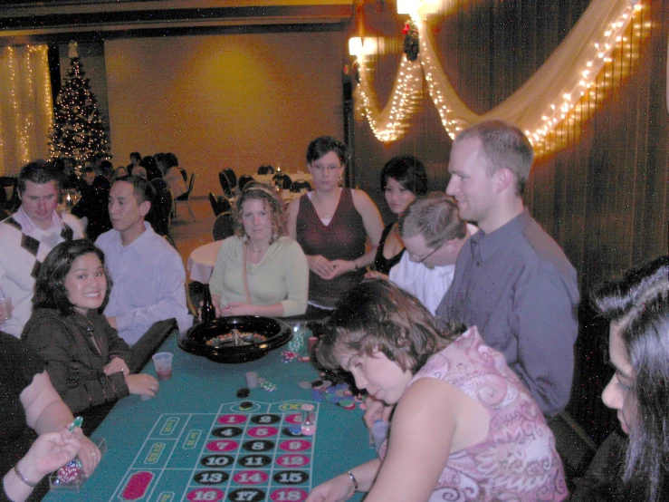 a group of people playing roule on the table