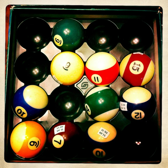 a collection of pool balls in a case