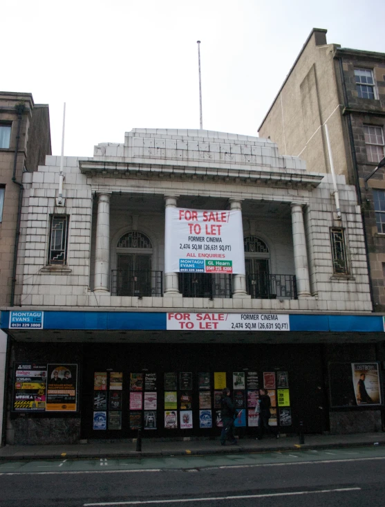 a large store with a poster advertising for sale