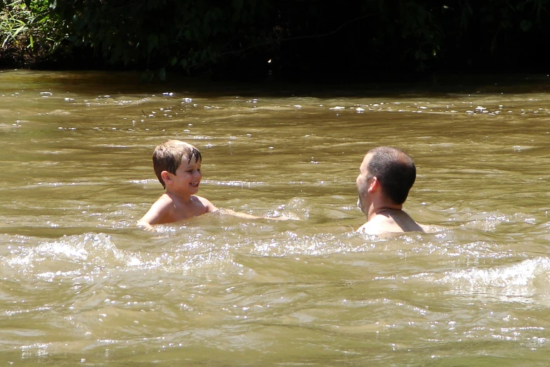 a  and older man playing in the water