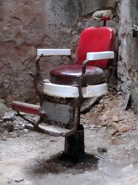 a chair that is sitting against a rock